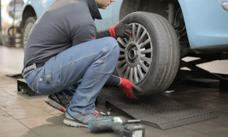 Man Changing a Car Tire