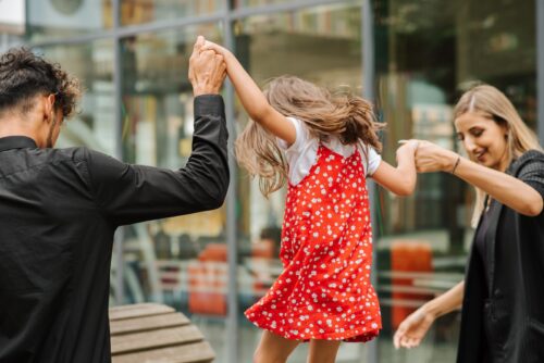 Family spending time together on street